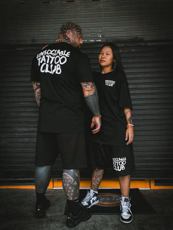 Unsociable Tattoo Club crew wearing club merch